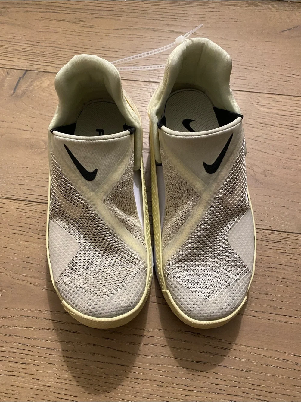 Nike Slip-On Sneakers in Pale Yellow, White and Black